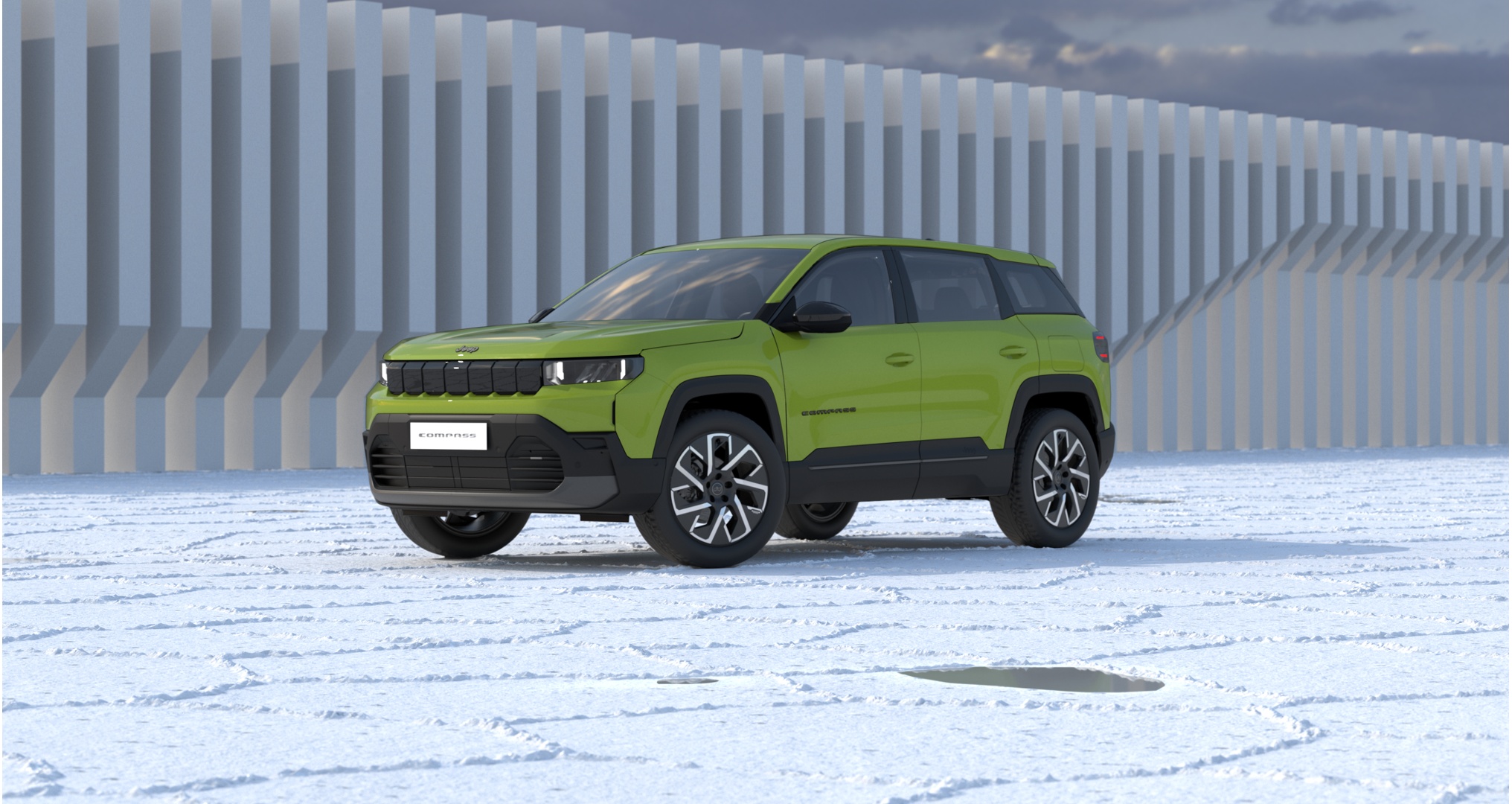 Jeep Compass Altitude PHEV e-Hybrid in Hawaii Green Metallic von vorne auf einer Eislandschaft